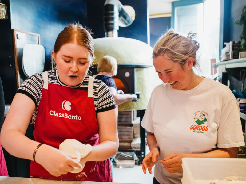 shaping dough at pizza making class